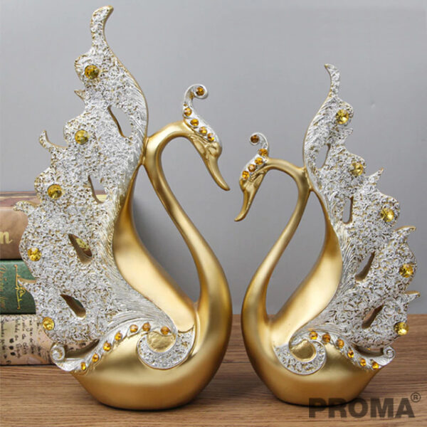 A Pair of Golden Swans Decorated with Amber Crystals.
